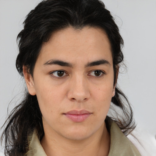 Joyful latino young-adult female with medium  brown hair and brown eyes
