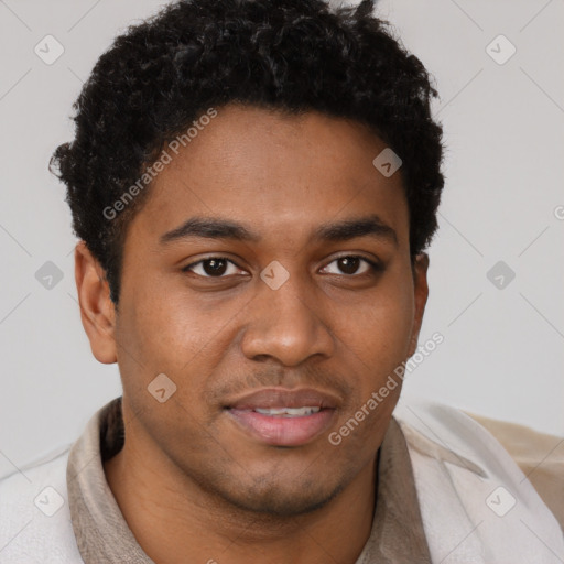 Joyful black young-adult male with short  brown hair and brown eyes