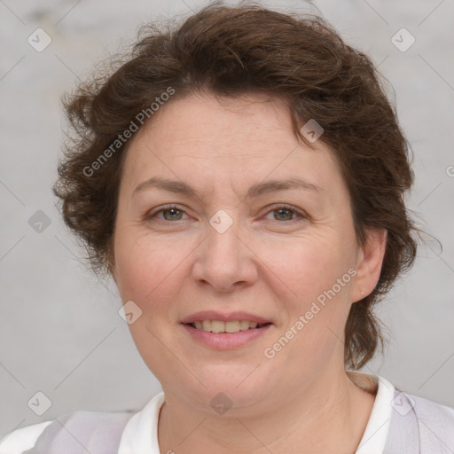 Joyful white adult female with short  brown hair and brown eyes