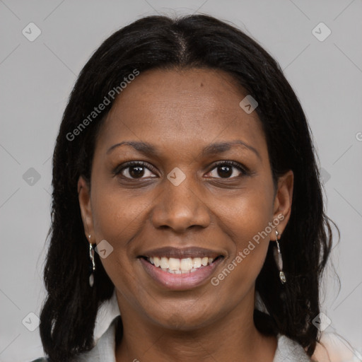 Joyful black young-adult female with medium  brown hair and brown eyes