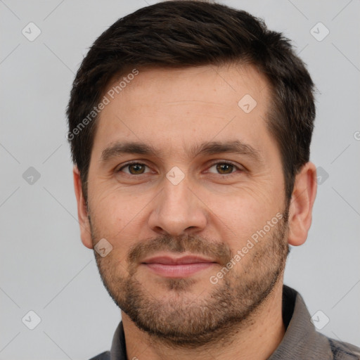 Joyful white adult male with short  brown hair and brown eyes