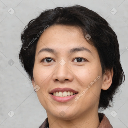 Joyful asian young-adult female with short  brown hair and brown eyes