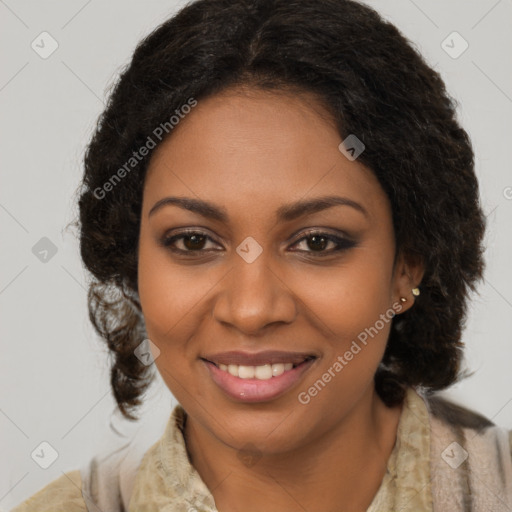 Joyful black young-adult female with long  brown hair and brown eyes