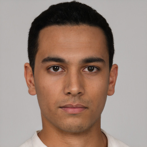 Neutral latino young-adult male with short  black hair and brown eyes