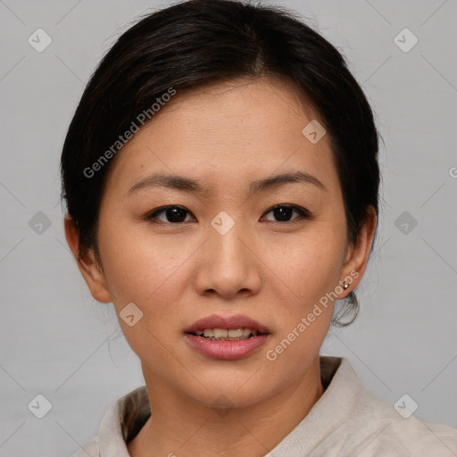 Joyful asian young-adult female with short  brown hair and brown eyes