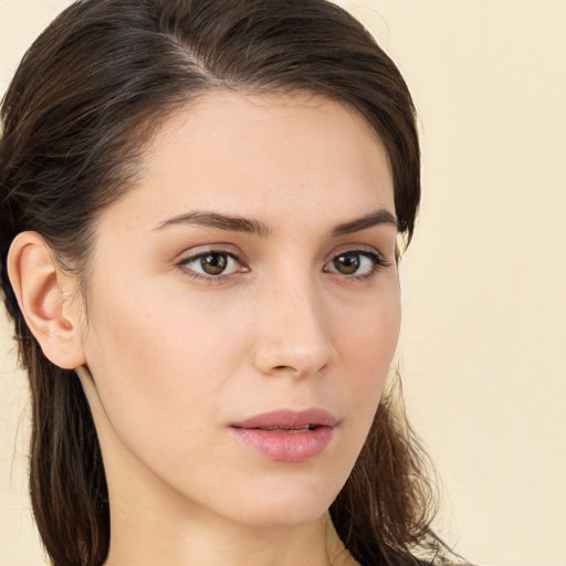 Neutral white young-adult female with long  brown hair and brown eyes