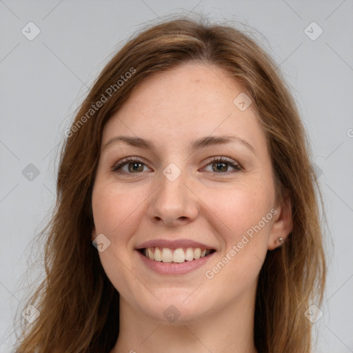 Joyful white young-adult female with long  brown hair and green eyes