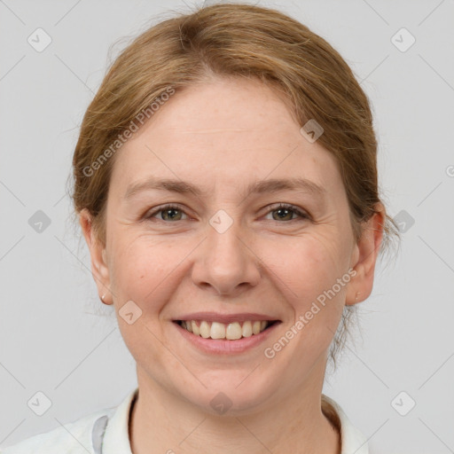 Joyful white adult female with medium  brown hair and grey eyes