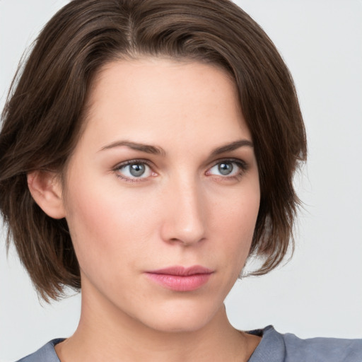 Neutral white young-adult female with medium  brown hair and green eyes