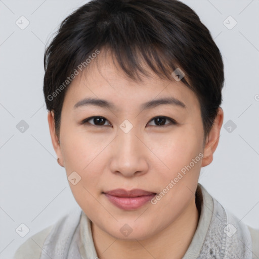 Joyful asian young-adult female with short  brown hair and brown eyes