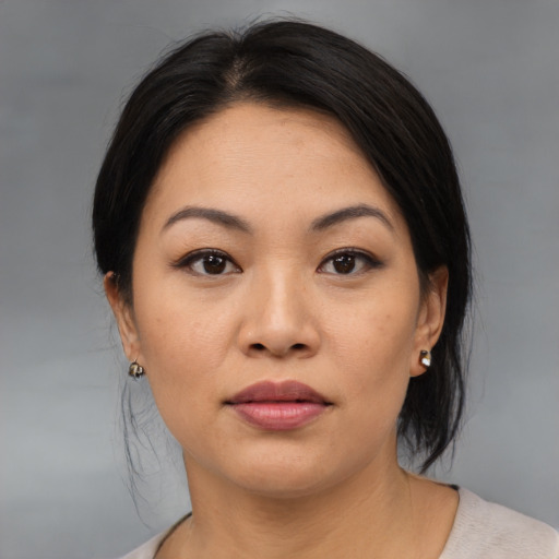 Neutral asian young-adult female with medium  black hair and brown eyes
