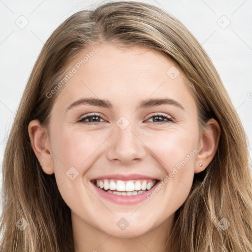 Joyful white young-adult female with long  brown hair and grey eyes