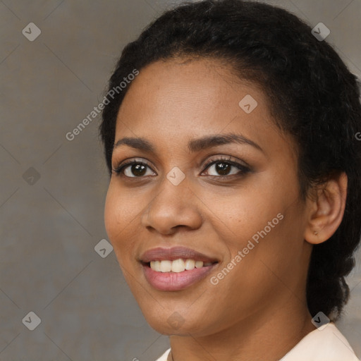 Joyful black young-adult female with medium  black hair and brown eyes