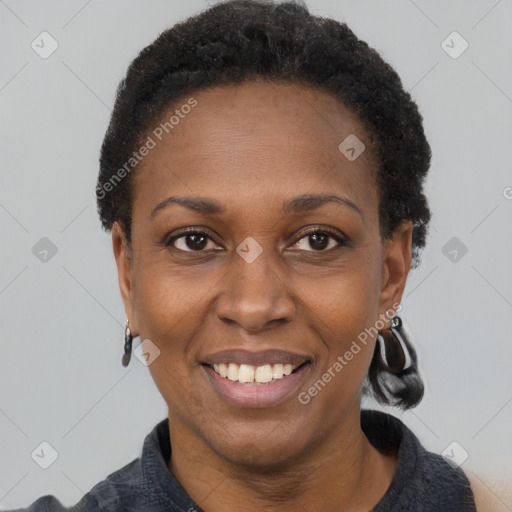 Joyful black adult female with short  black hair and brown eyes