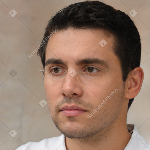 Neutral white young-adult male with short  black hair and brown eyes