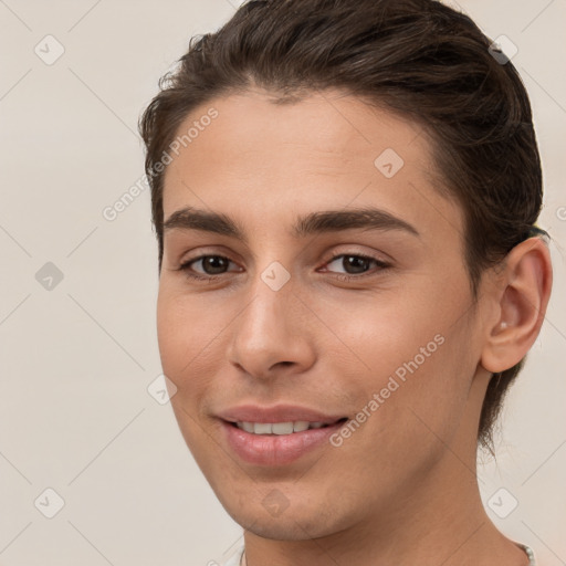 Joyful white young-adult male with short  brown hair and brown eyes