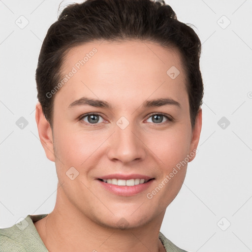 Joyful white young-adult female with short  brown hair and grey eyes