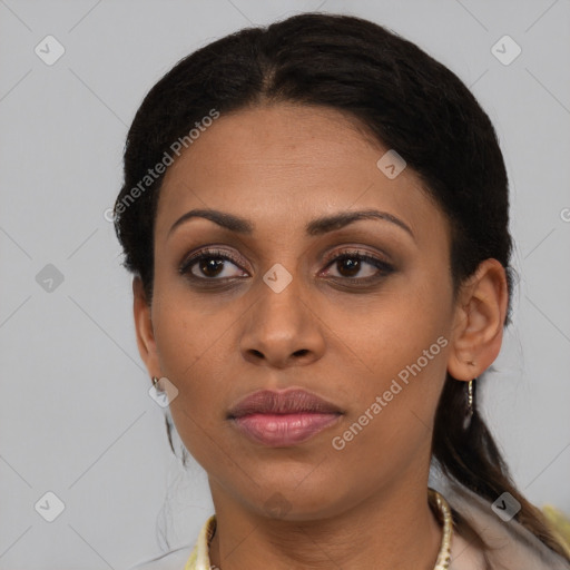 Joyful black young-adult female with medium  brown hair and brown eyes