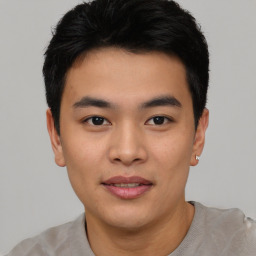 Joyful asian young-adult male with short  black hair and brown eyes