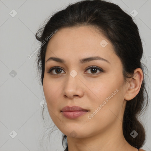 Joyful latino young-adult female with medium  brown hair and brown eyes