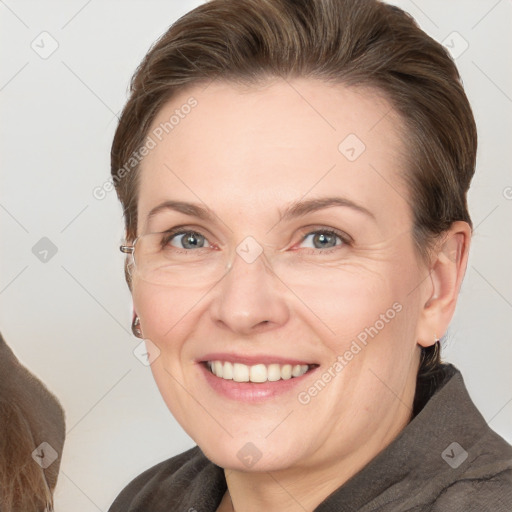 Joyful white adult female with short  brown hair and grey eyes