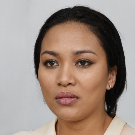 Neutral latino young-adult female with medium  black hair and brown eyes