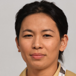 Joyful asian adult female with short  brown hair and brown eyes