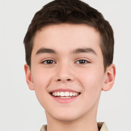 Joyful white child male with short  brown hair and brown eyes