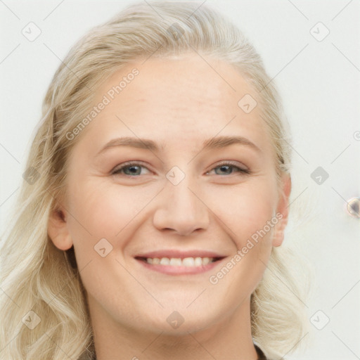 Joyful white young-adult female with long  brown hair and blue eyes