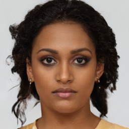 Neutral black young-adult female with medium  brown hair and brown eyes