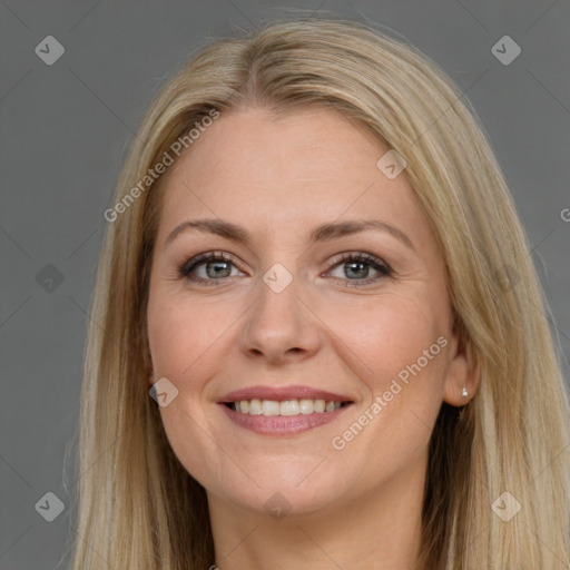 Joyful white adult female with long  brown hair and grey eyes