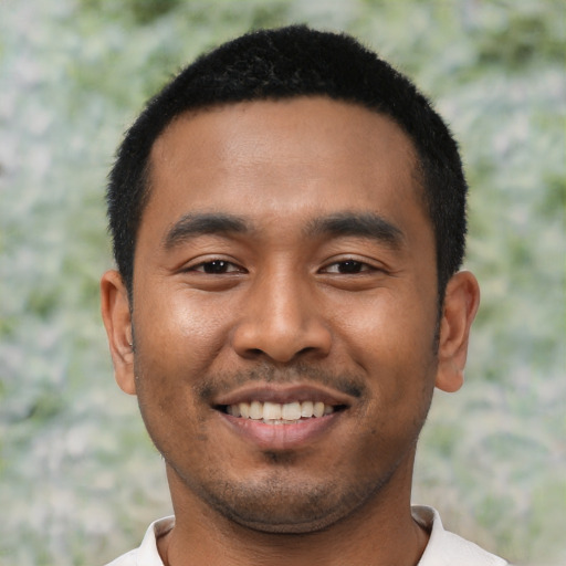 Joyful asian young-adult male with short  black hair and brown eyes