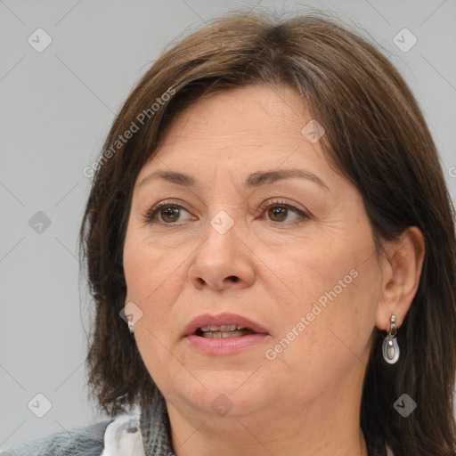 Joyful white adult female with medium  brown hair and brown eyes