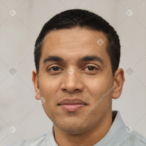 Joyful latino young-adult male with short  black hair and brown eyes