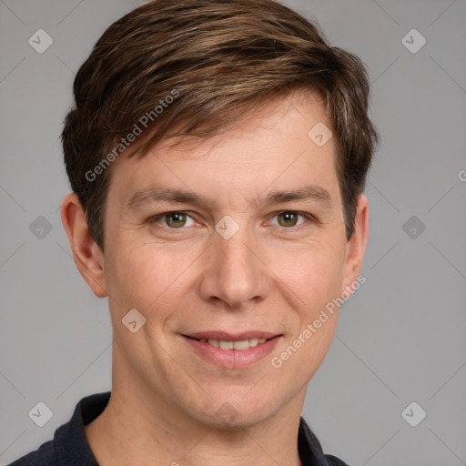 Joyful white adult male with short  brown hair and grey eyes