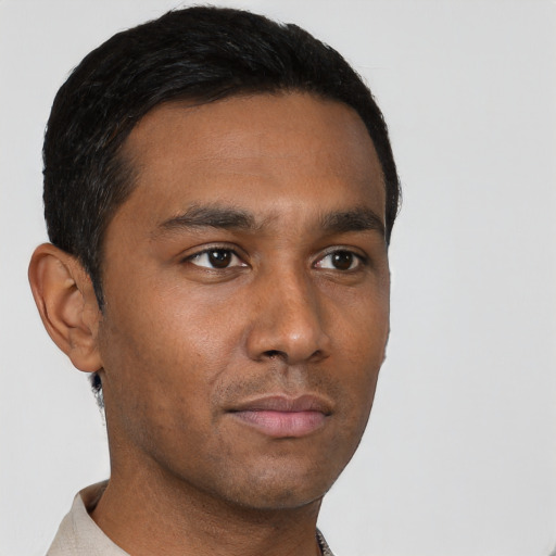 Neutral black young-adult male with short  brown hair and brown eyes