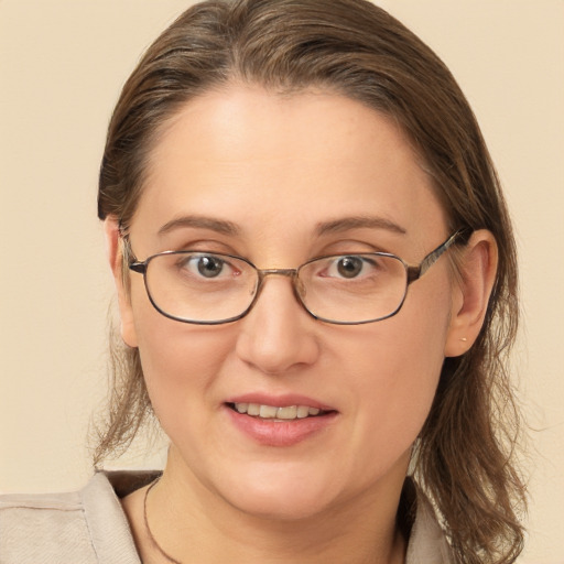 Joyful white young-adult female with medium  brown hair and brown eyes