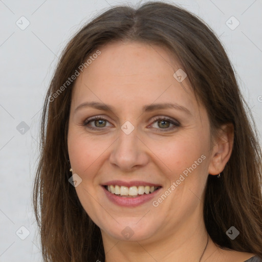 Joyful white adult female with long  brown hair and brown eyes