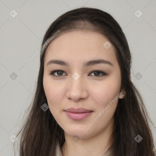 Joyful asian young-adult female with long  brown hair and brown eyes