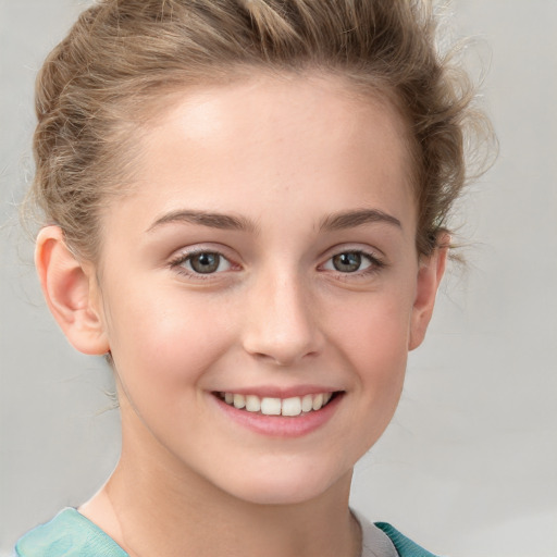 Joyful white child female with short  brown hair and grey eyes