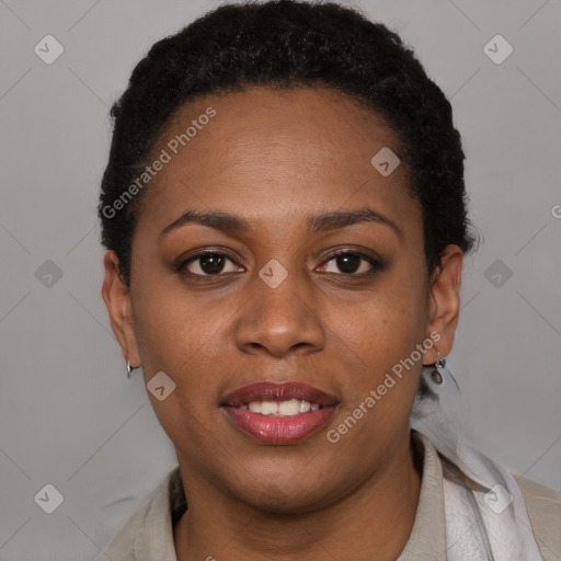 Joyful black young-adult female with short  black hair and brown eyes