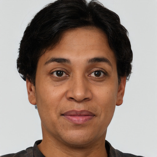 Joyful white adult female with short  brown hair and brown eyes