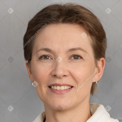 Joyful white adult female with short  brown hair and grey eyes