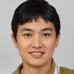 Joyful latino young-adult male with short  brown hair and brown eyes