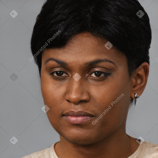 Joyful black young-adult female with short  black hair and brown eyes