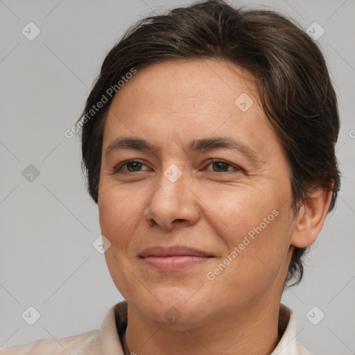 Joyful white adult female with short  brown hair and brown eyes