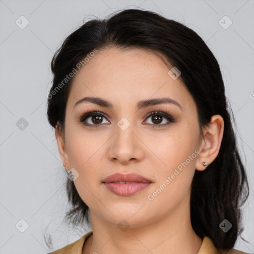 Joyful latino young-adult female with medium  brown hair and brown eyes