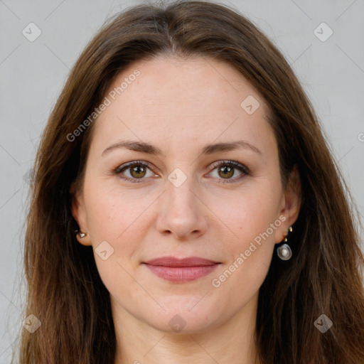 Joyful white young-adult female with long  brown hair and green eyes