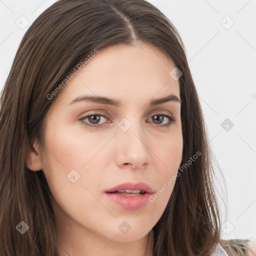 Neutral white young-adult female with long  brown hair and brown eyes