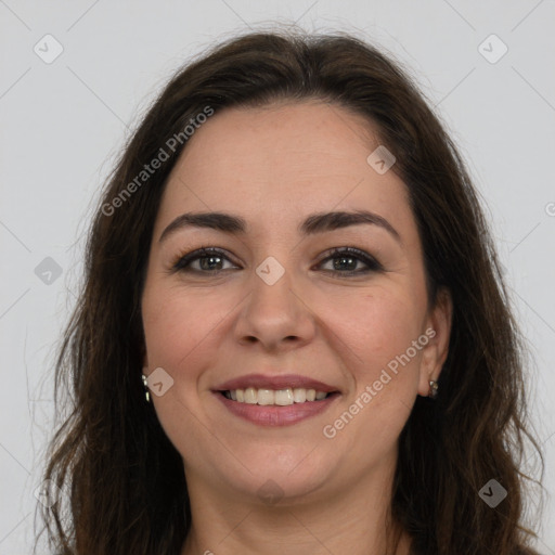 Joyful white young-adult female with long  brown hair and brown eyes